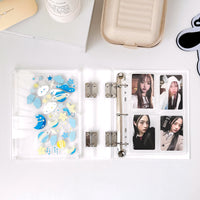Binder open with a page of photos of K-Pop Stars or pics of your best fan-friends