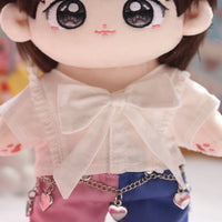 Close up of bow and heart chain on outfit