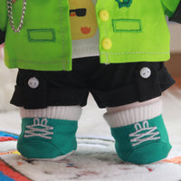 Close up image of embroidered details on dark green boots