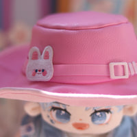 Close up image of details on pink hat w/ rabbit