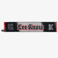 Photo of black, red and gray towel with Lee Know’s name