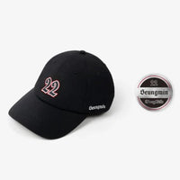 Black tour cap with “22” on the front and “Seungmin” on the side
