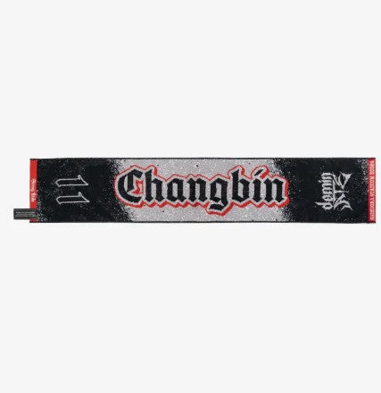 Photo of black, red and gray towel with Changbin’s name