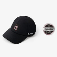 Black tour cap with “11” on the front and “Changbin” on the side