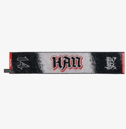 Photo of black, red and gray towel with Han’s name