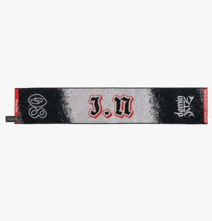 Photo of black, red and gray towel with I.N.’s name