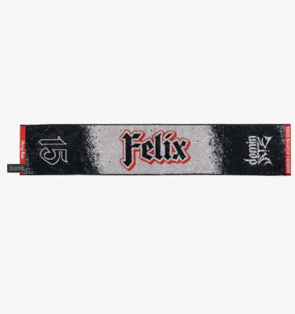 Photo of black, red and gray towel with Felix’s name