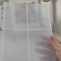 Video of the binder being open and closed with a shake to demo the charms