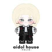 Felix plushie with a black outfit on a white background, featuring 'aidol house' branding.