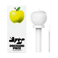 A YVES official light stick, predominantly white, with a green apple on the packaging and the text 'ORCHARD PIECE'.